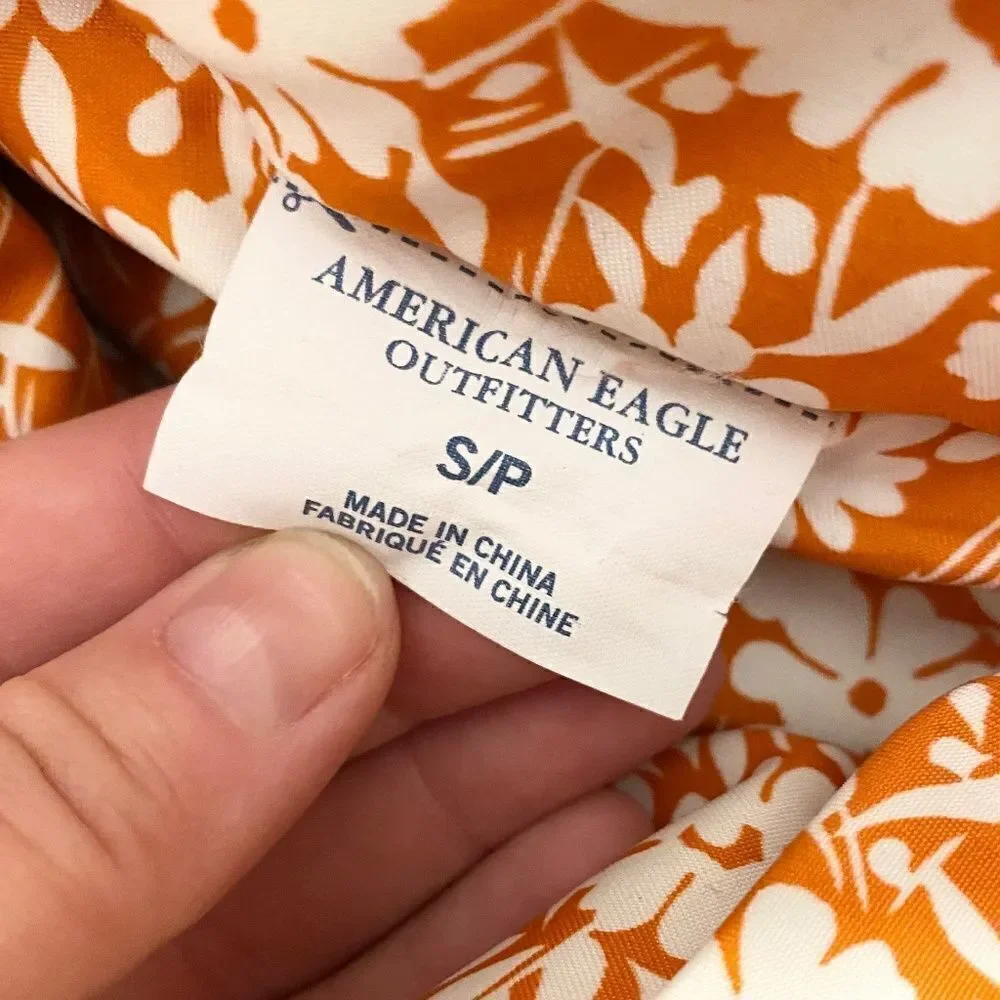 American Eagle reversible puffer vest red, orange, white, flowers. Size S/P